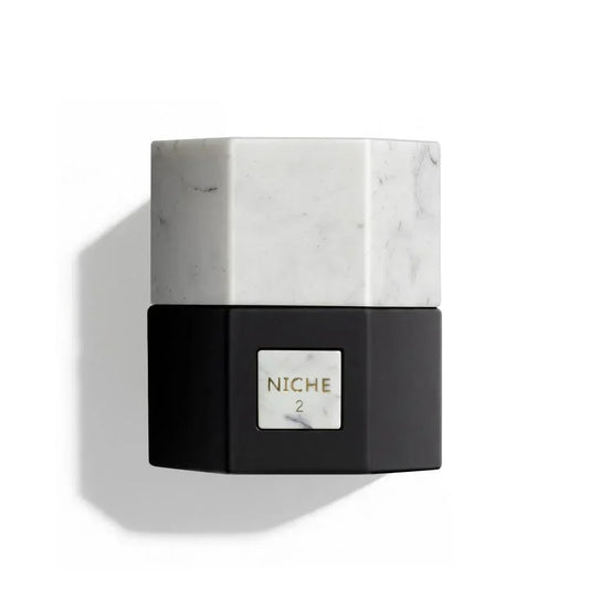 Niche 2 luxury perfume bottle with marble cap and black base, elegant fragrance design