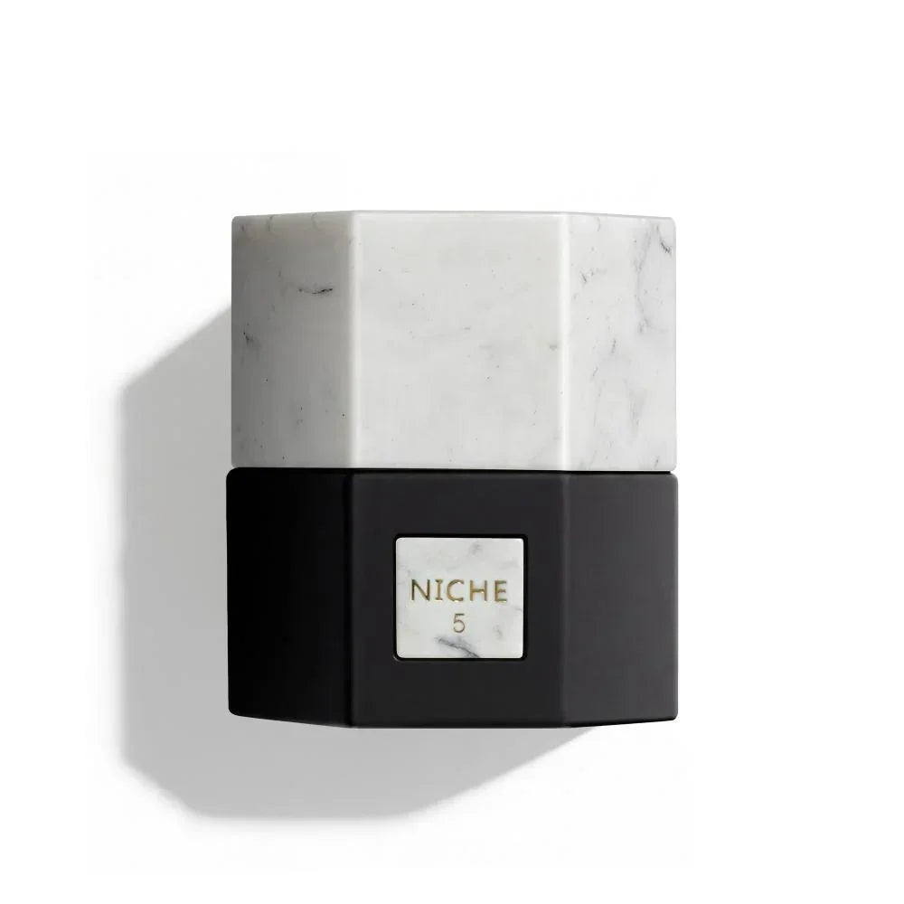 Niche 5 luxury perfume bottle with marble cap and black base, elegant fragrance design