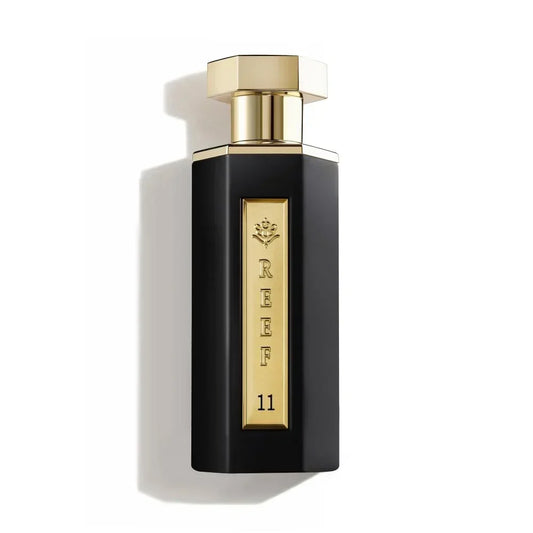 Luxury black perfume bottle with gold cap and REEF 11 branding, evoking oriental fragrance notes