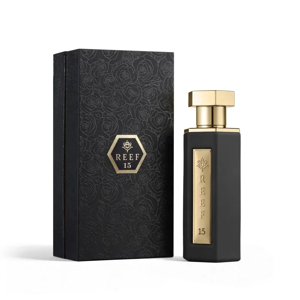 REEF 15 luxury perfume bottle with black rose-patterned gift box, gold accents, elegant unisex fragrance