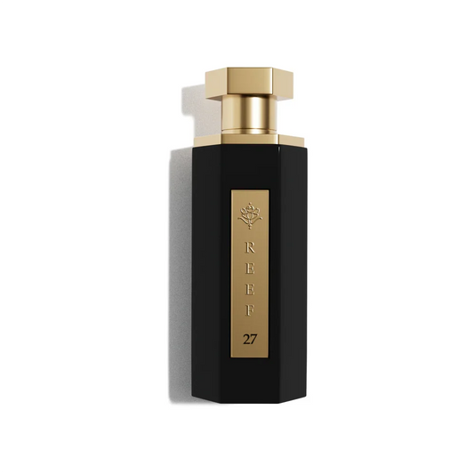 Elegant black perfume bottle with gold accents, labeled REEF 27, evoking luxury and oriental fragrance notes
