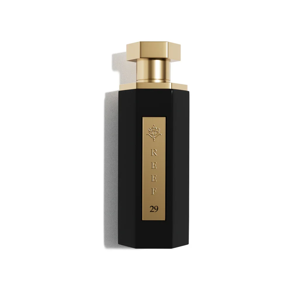Elegant black perfume bottle with gold accents, REEF 29, luxury fragrance design