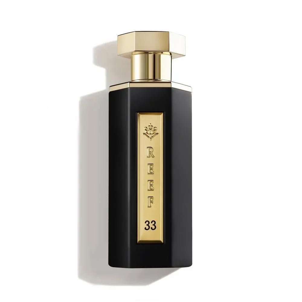 Luxury black perfume bottle with gold cap and REEF 33 label, evoking oriental fragrance notes