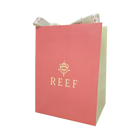 REEF luxury perfume gift bag with elegant ribbon, perfect for Oriental fragrance presents
