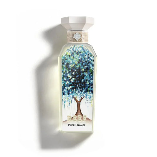 REEF Pure Flower perfume bottle with floral tree design, evoking Arabian garden essence