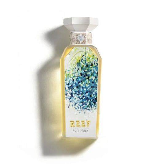 REEF Pure Musk perfume bottle with blue floral design and elegant white cap