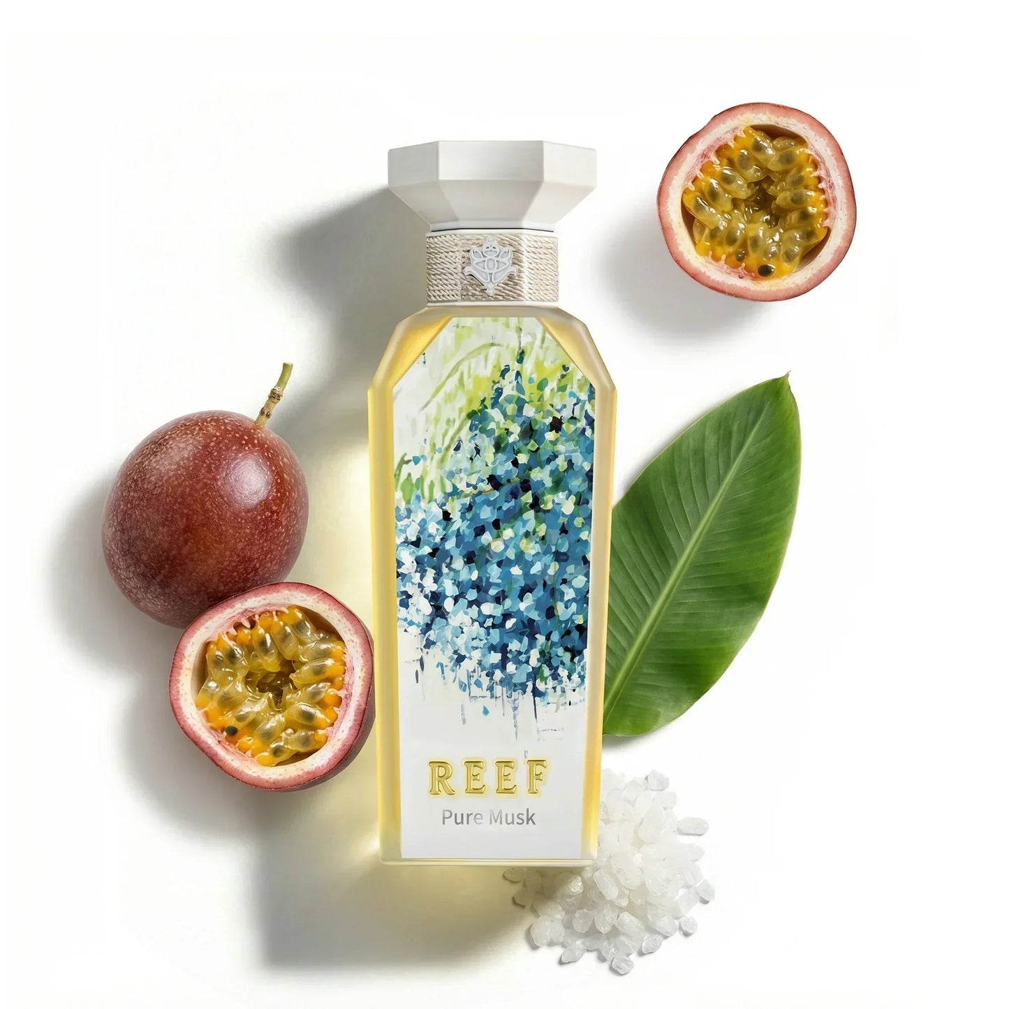 REEF Pure Musk perfume bottle with passionfruit and green leaf accents
