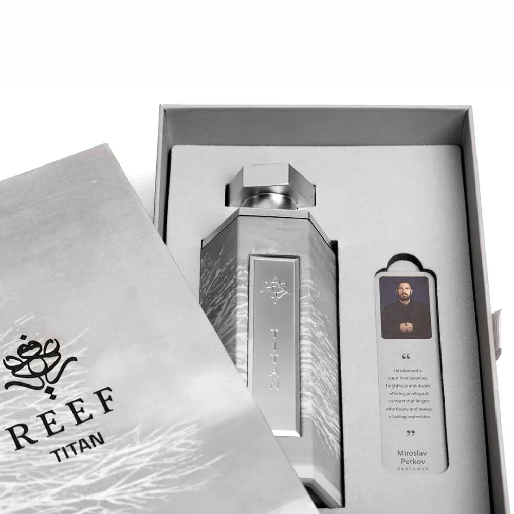 REEF Titan perfume bottle in luxury packaging with designer quote card